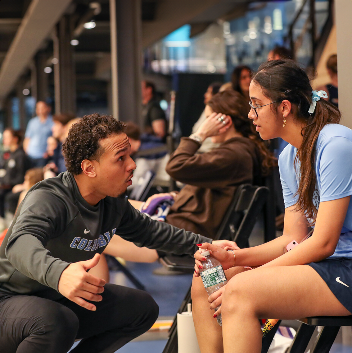 Coach mentoring student