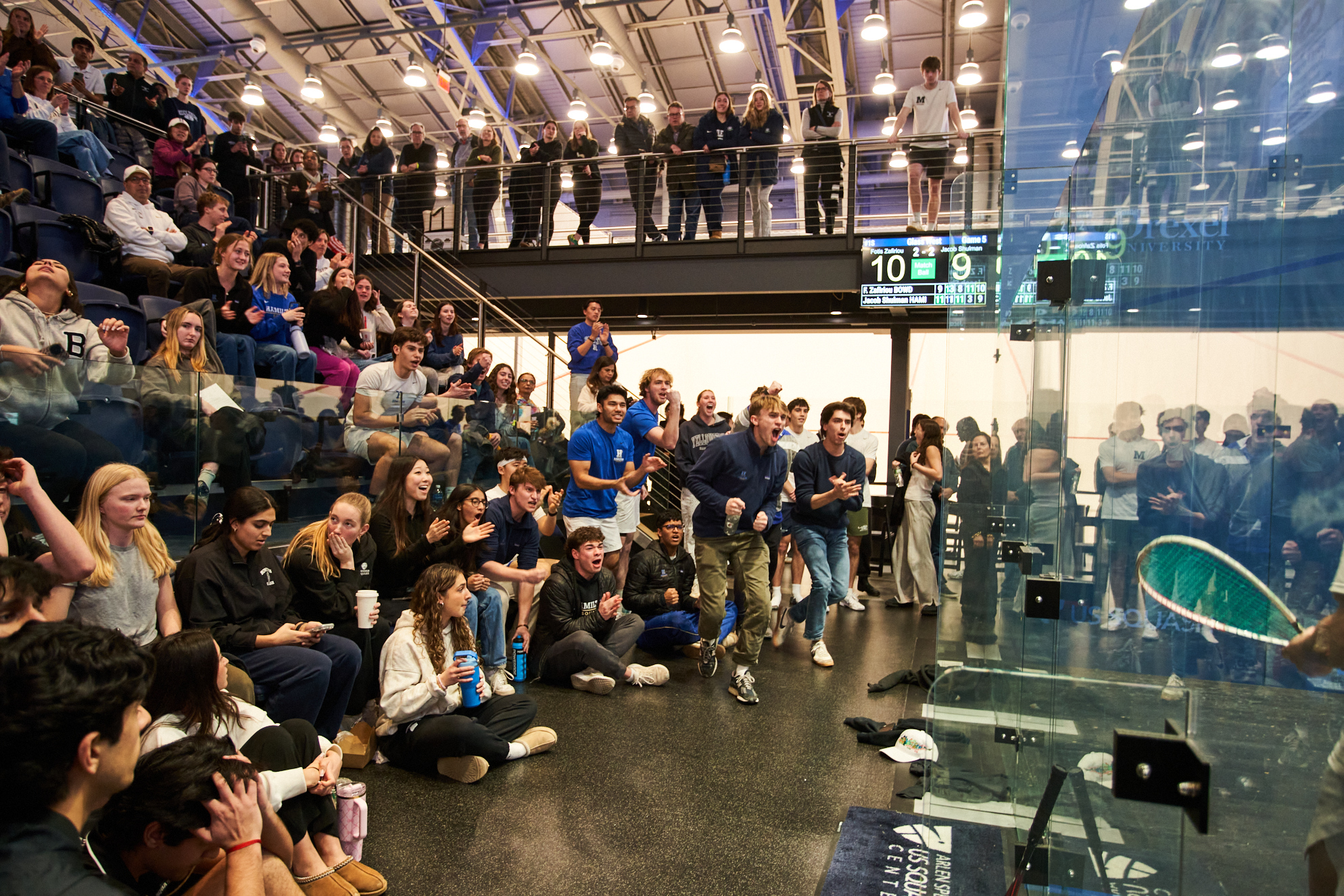 Teammates Cheering Behind the Glass