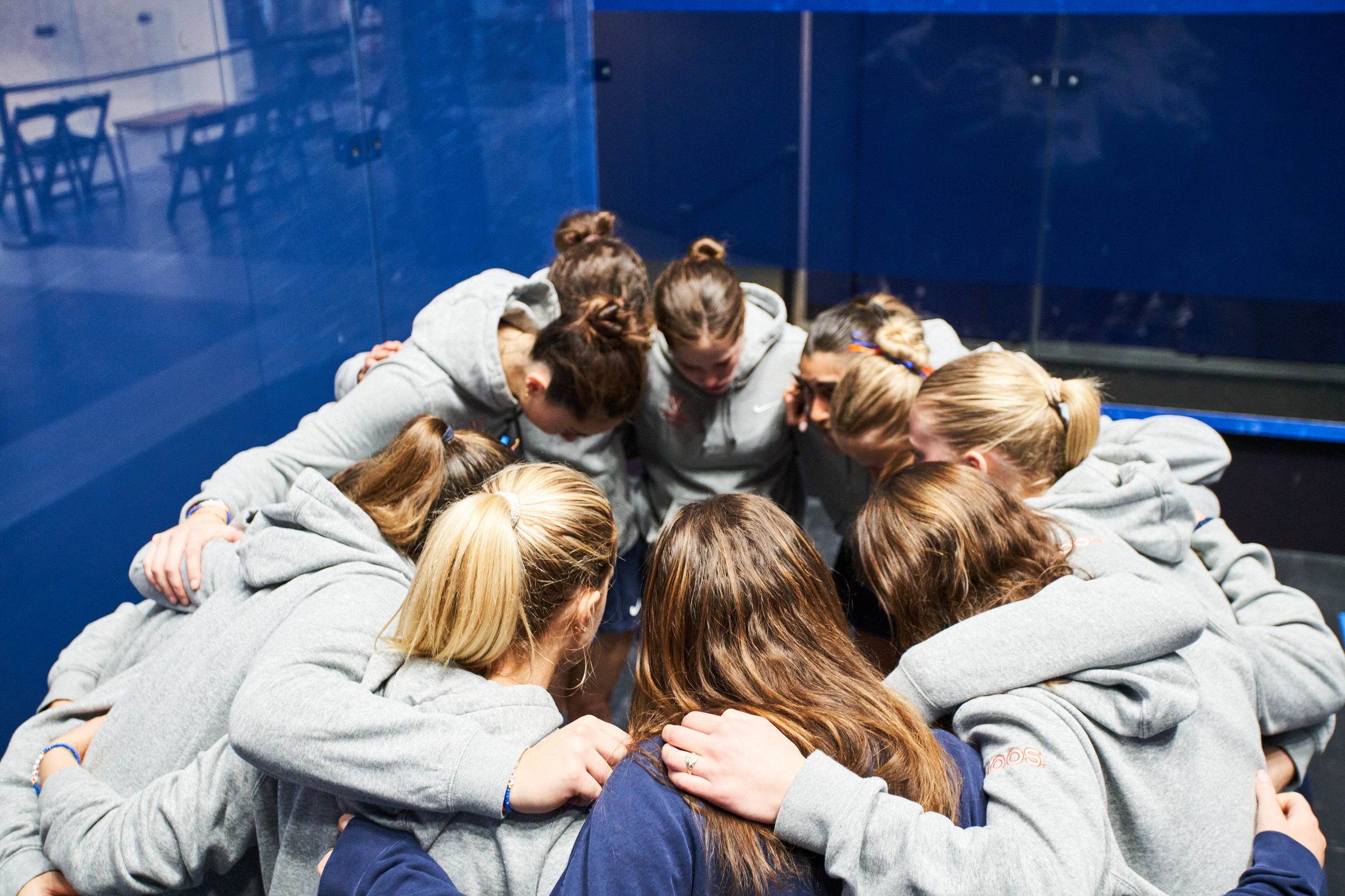 College Squash Team Huddle